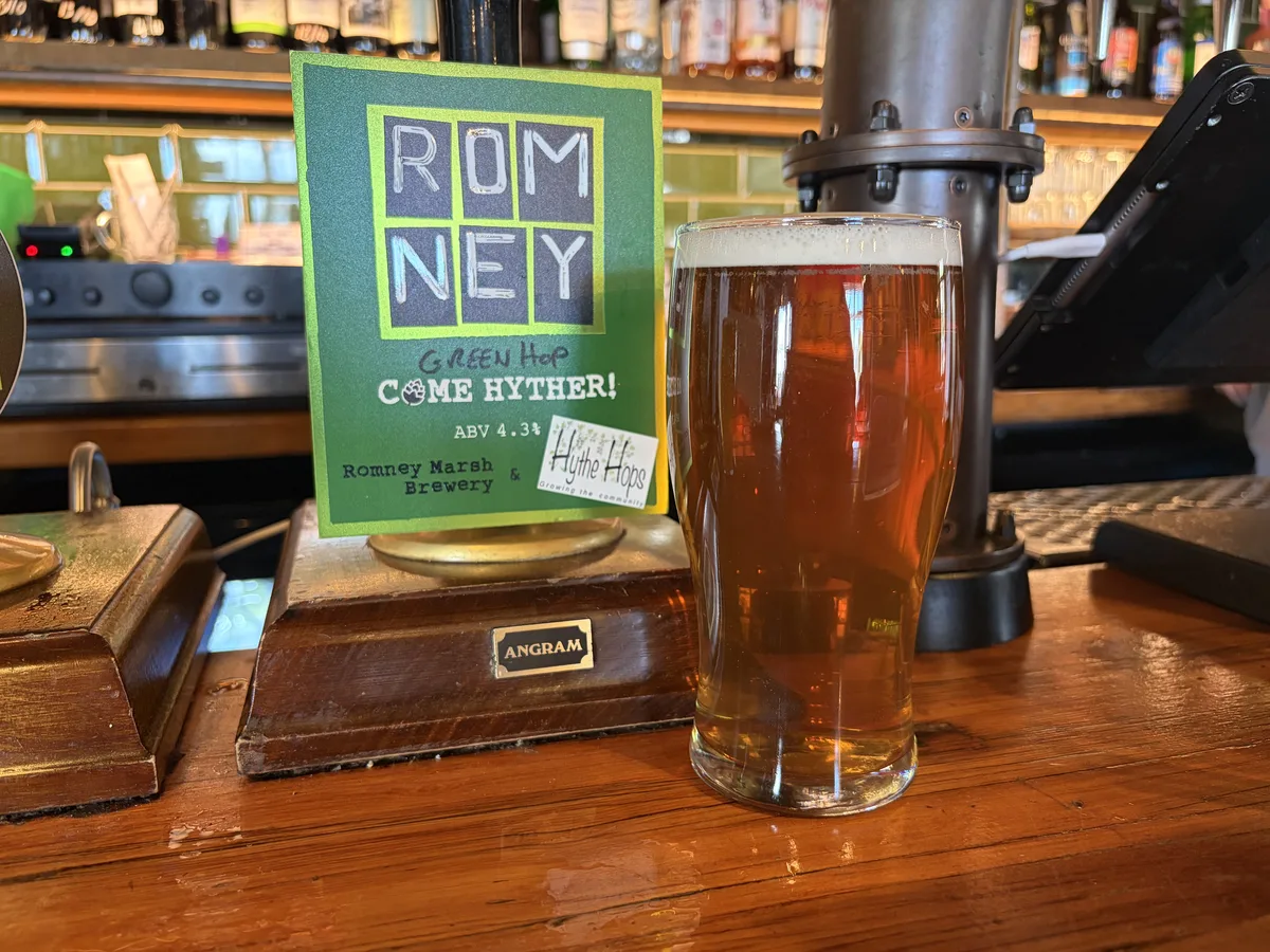 A pint of Come Hyther Green on the bar at Harbour Inn, beside its Romney Marsh Brewery pump clip
