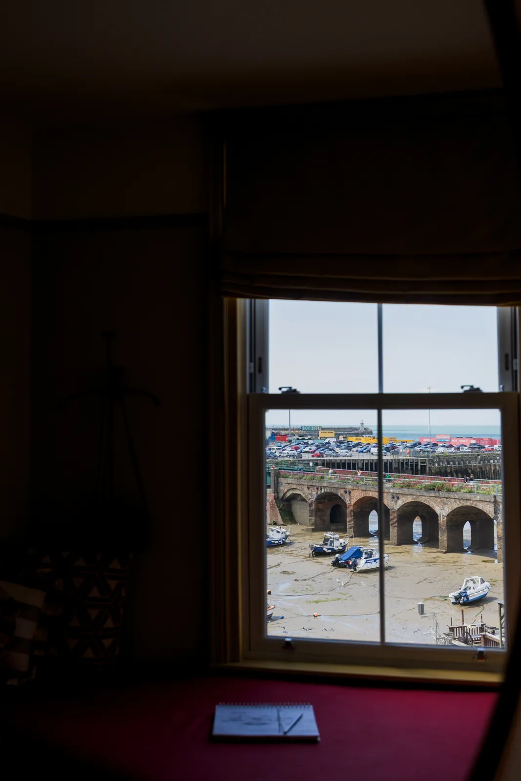 Room 7's window above a pink window seat, framing the harbour viaduct arches