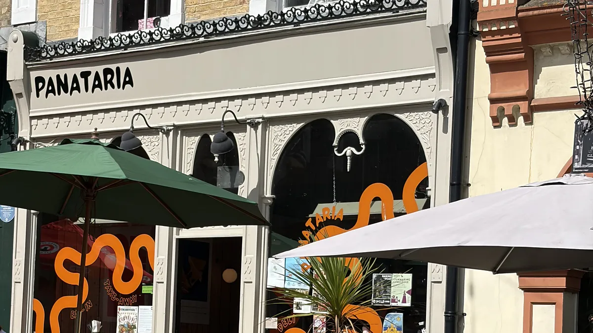 Panataria’s cream shopfront on Rendezvous Street, with its name above the arched windows and orange-wave window graphics