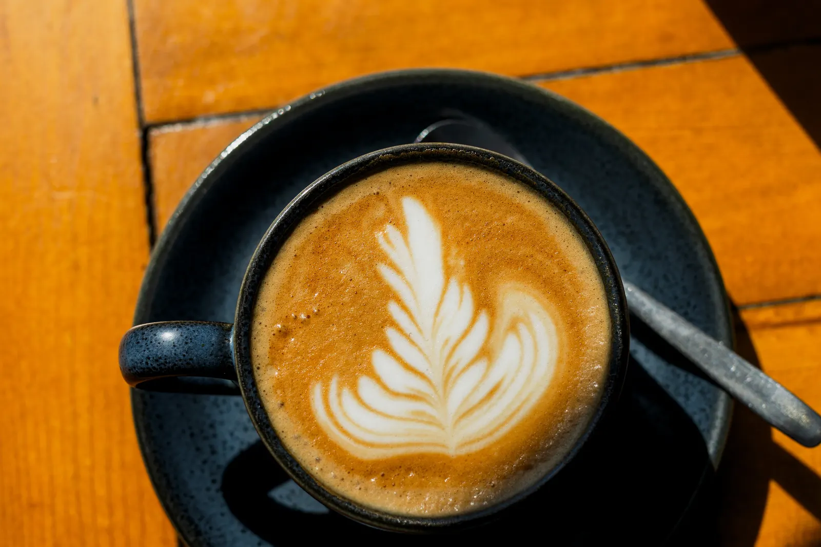 A latte with leaf art at London & Paris Hotel, Folkestone