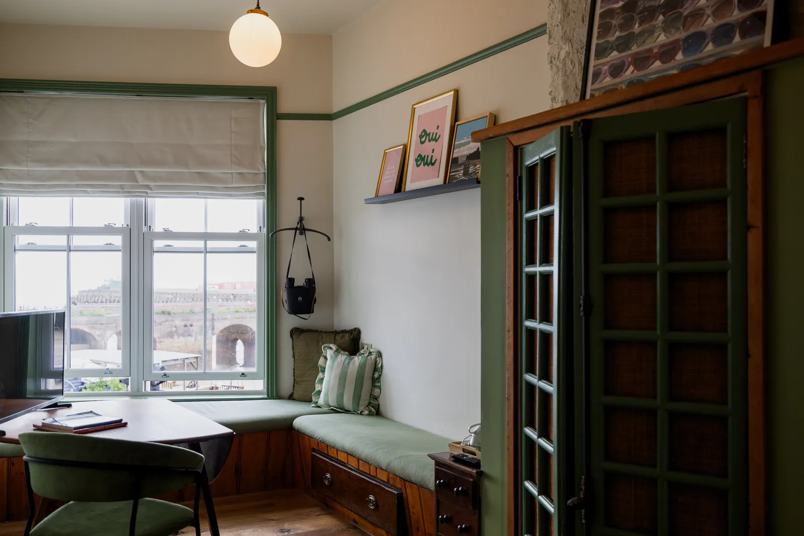 The cushioned window seat and desk in Room 3 at London & Paris Hotel, Folkestone