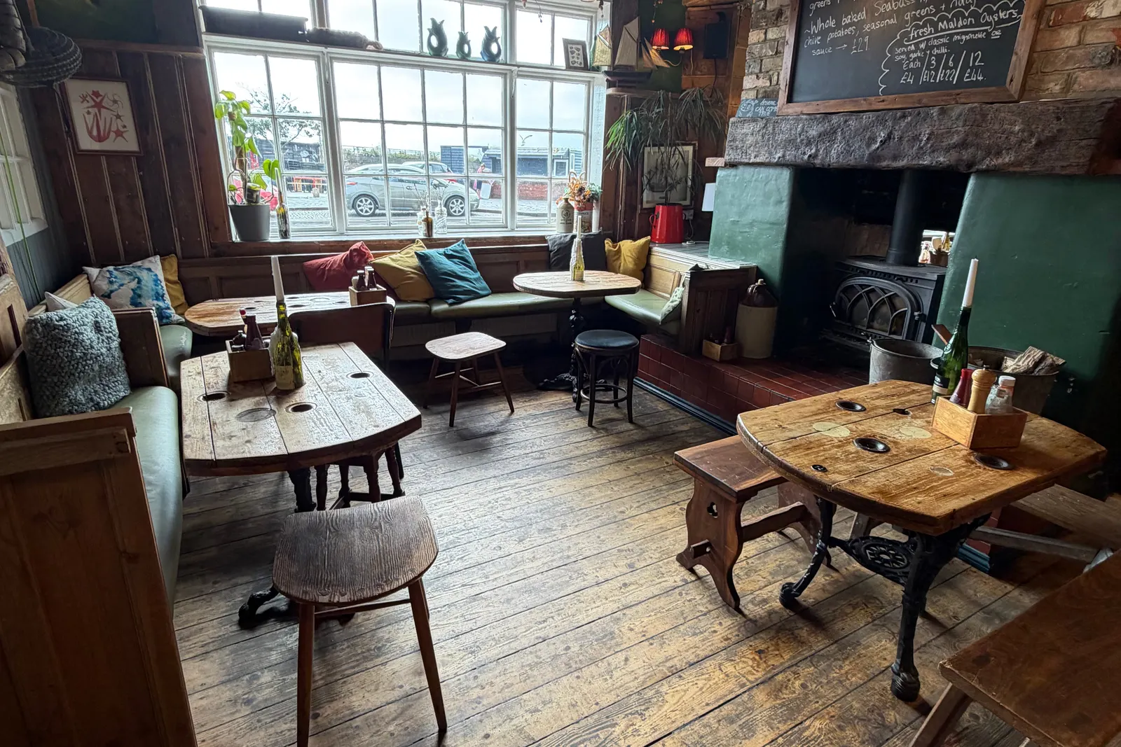 Tables by the harbour-facing windows in Harbour Inn's dining room, Folkestone