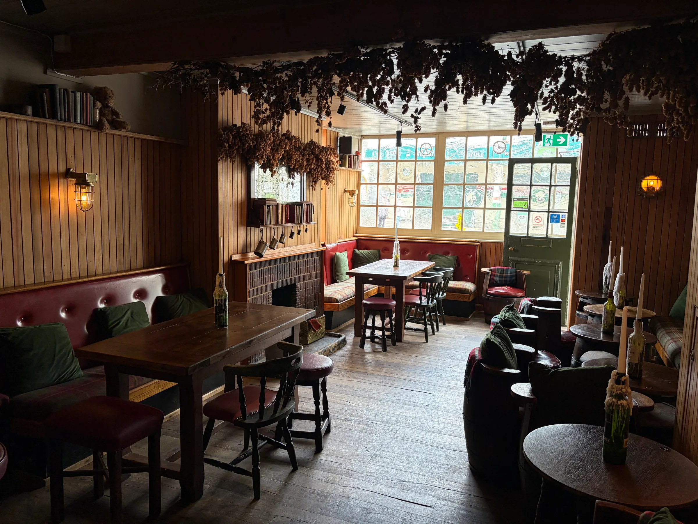 Leather armchairs and dried hops in the lounge at The Ship Inn, Sandgate